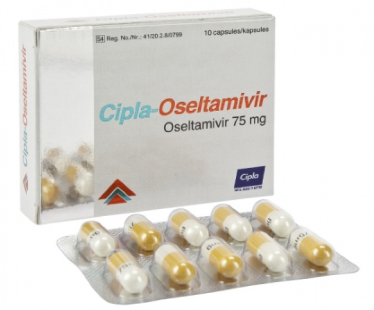 На фото таблетки "Озельтамивир" - лекарство от гриппа и простуды нового поколения на основе ингибиторов нейраминидазы.