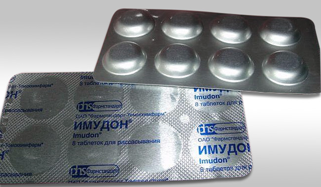 Иммудон выпускается в виде таблеток для рассасывания белого или почти белого цвета, они имеют плоскоцилиндрическую форму со скошенными краями
